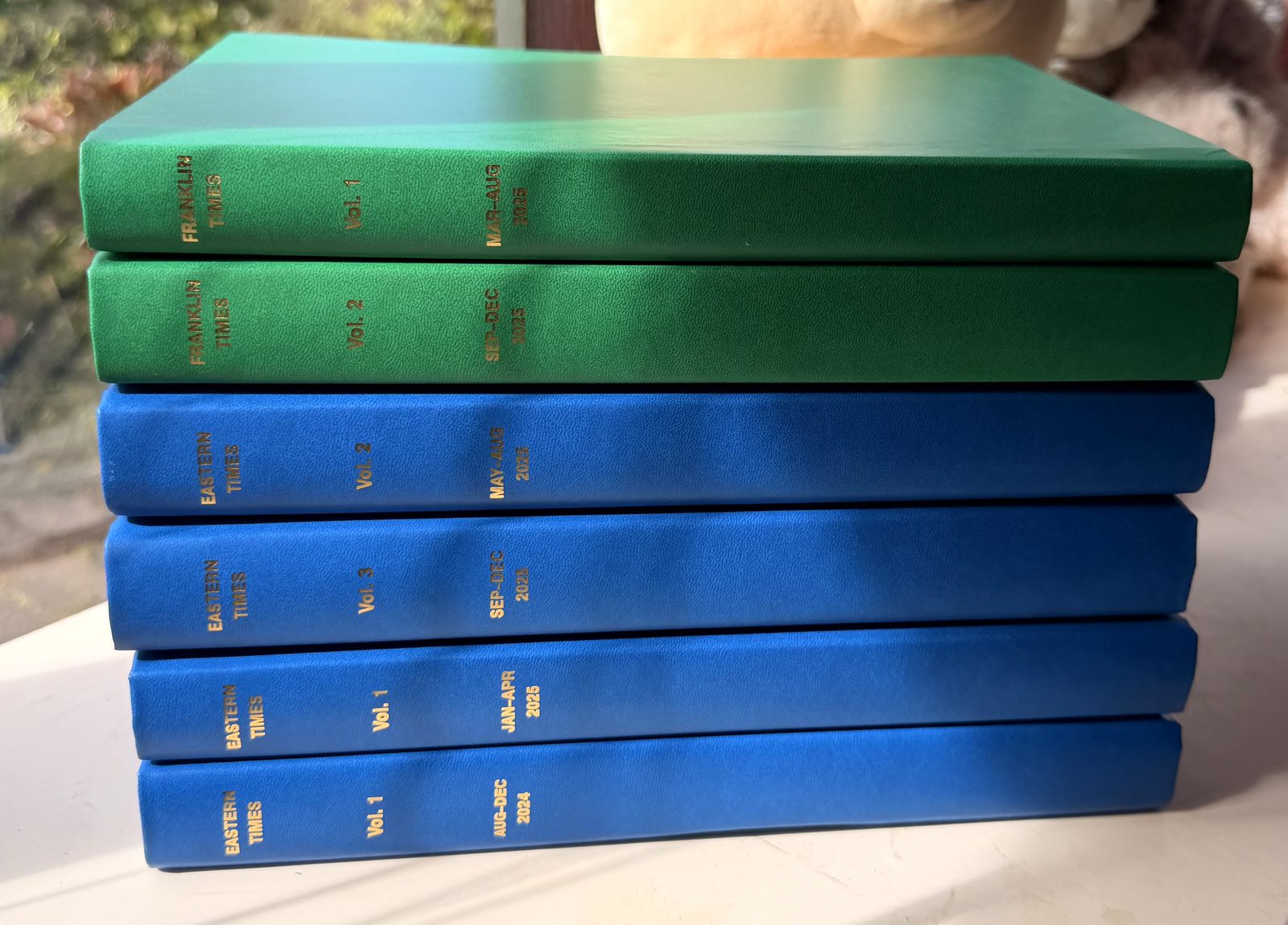 Blue and Green Leatherette, gold-lettered spines